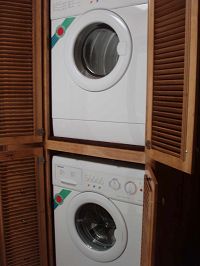 Stacked, energy-efficient washer/dryer in bathroom