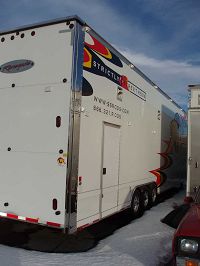 3 10,000 lb. axles, 2 passenger-side access doors, & exterior worklights