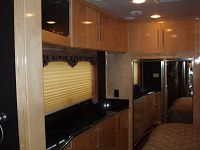 Full-size mirrored closet & pop-up 26 in. counter LCD TV 