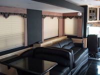 J-shaped lounge & 4-person dinette in full-length slide-out