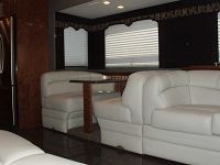 J-shaped lounge & 4-person dinette in full-length slide-out