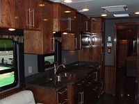 A deep sink, stainless microwave & beadboard paneling too