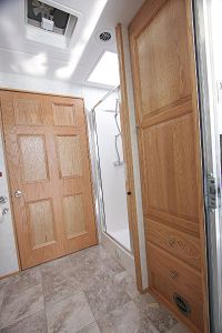 Full-size shower, lots of storage & venting fan in Bathroom