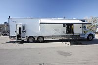 Passenger side w/access ramp, garage door & extended awning