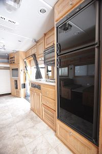 Kitchen w/full fridge/freezer, microwave & sink